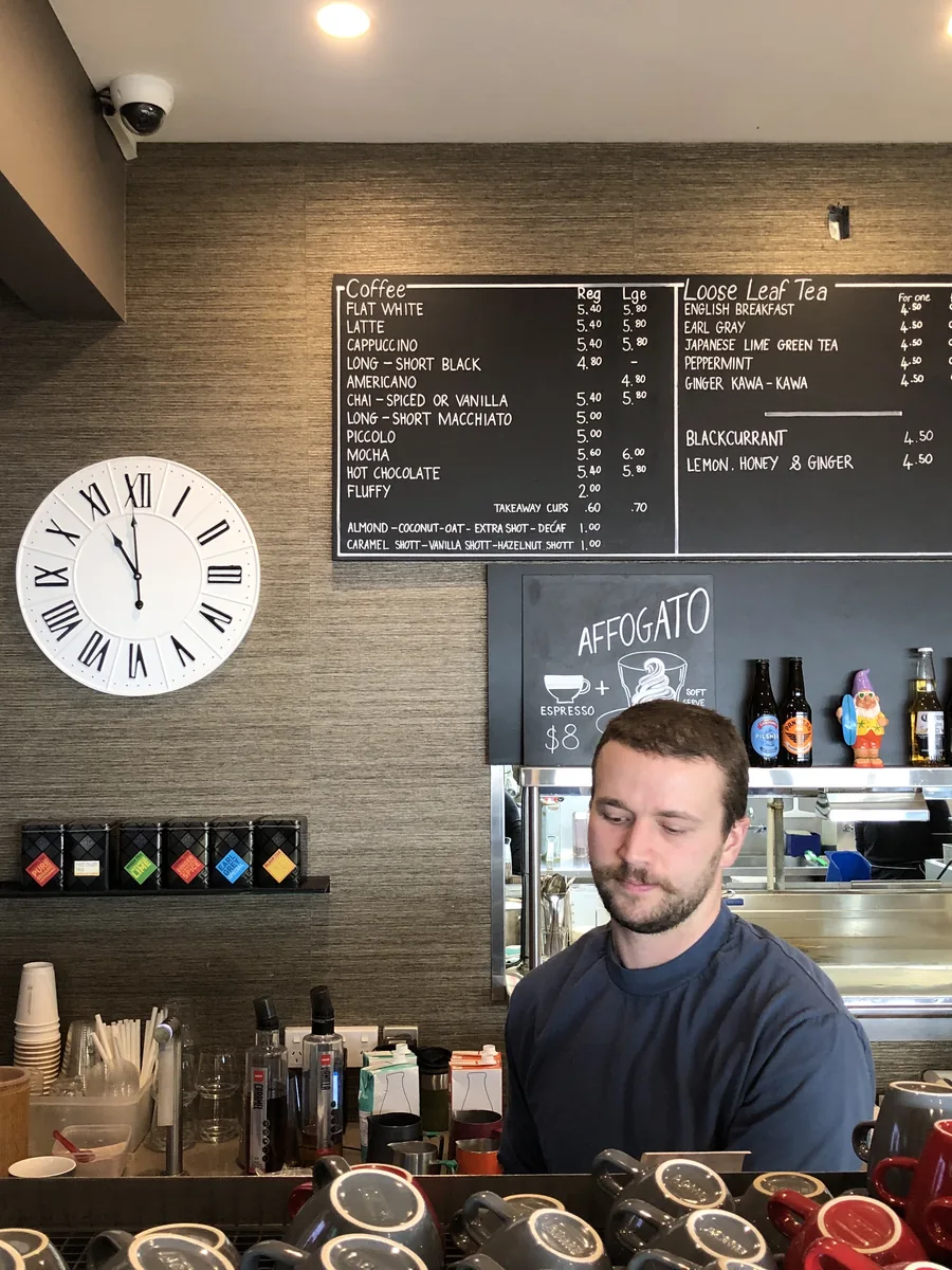 The coffee counter and menu board at Scarborough Fare